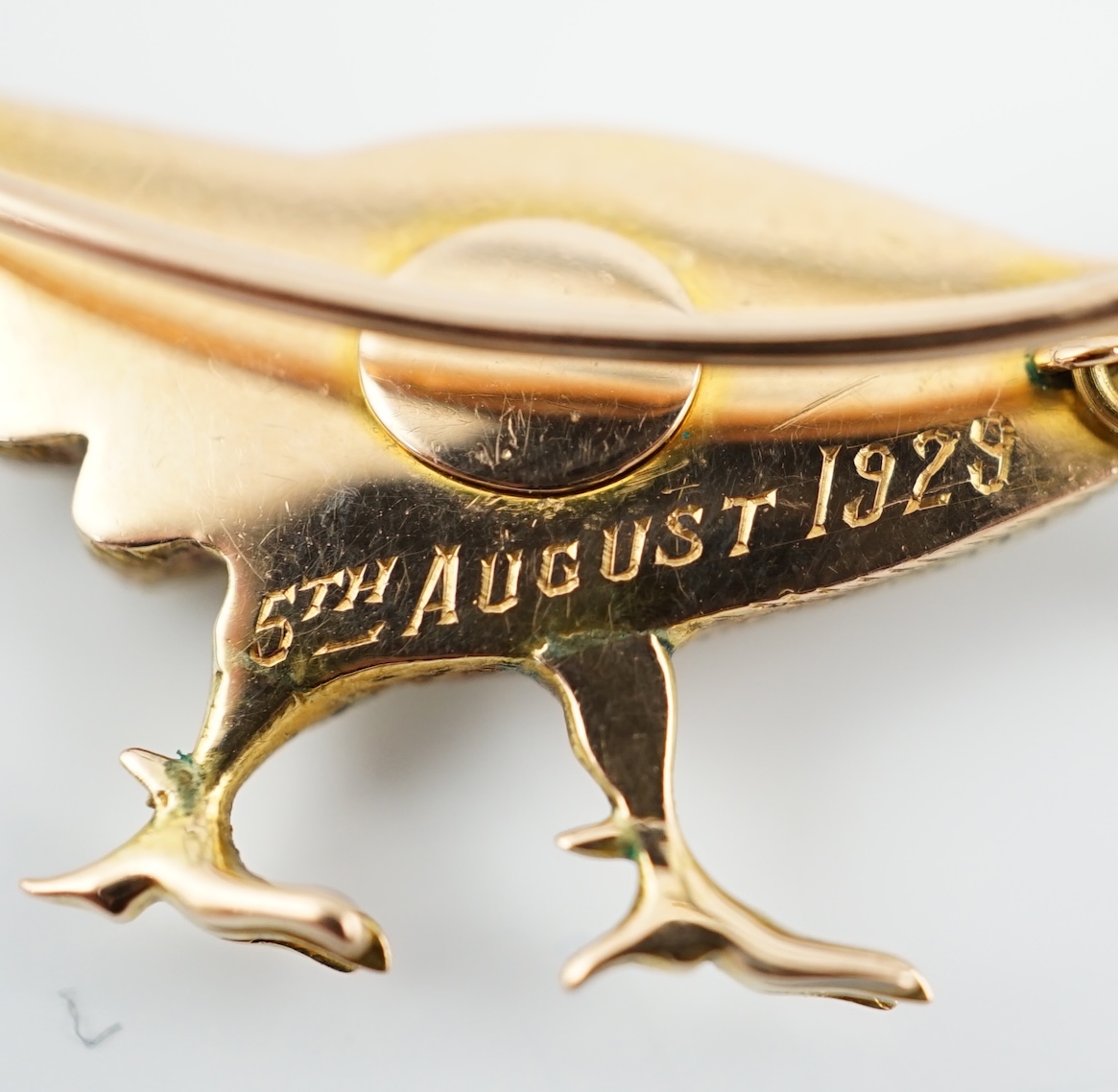 A George V three colour gold and enamelled pheasant brooch